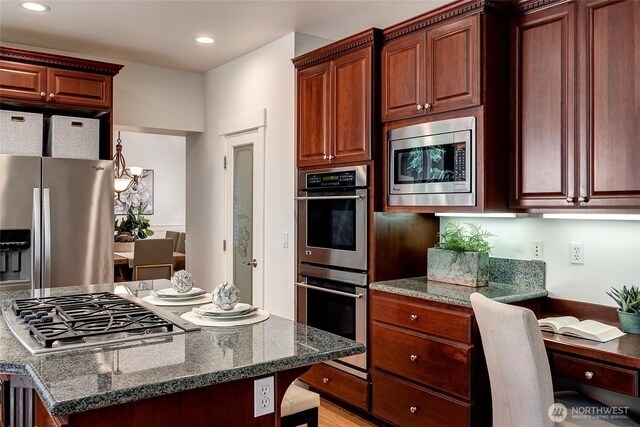 1122 140th Ave SE, Bellevue, WA 98005 - kitchen featuring appliances with stainless steel finishes, dark stone countertops, recessed lighting, and a center island