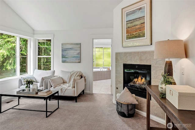 1122 140th Ave SE, Bellevue, WA 98005 - living area with a tiled fireplace, healthy amount of natural light, lofted ceiling, carpet, and baseboards