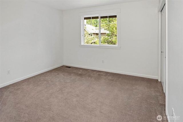 1122 140th Ave SE, Bellevue, WA 98005 - unfurnished bedroom featuring carpet flooring, baseboards, and a closet