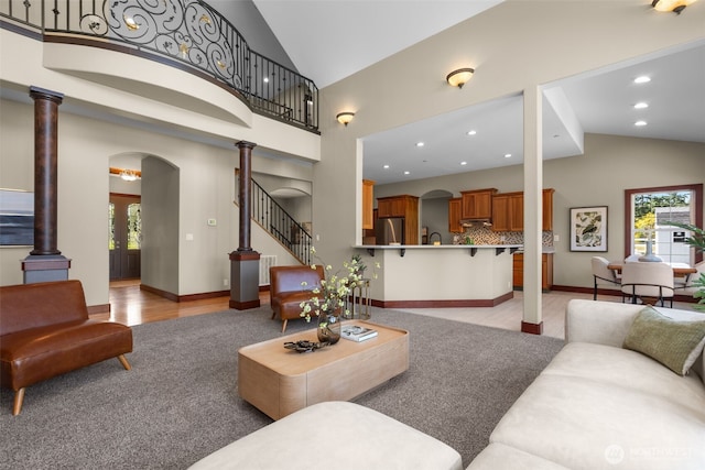 24022 SE 384th St, Enumclaw, WA 98022 - living room with arched walkways, stairs, baseboards, recessed lighting, and high vaulted ceiling