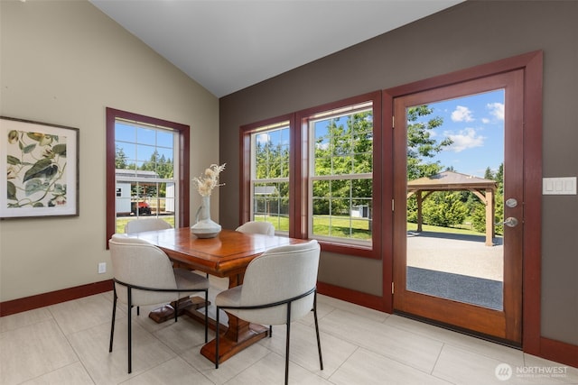 24022 SE 384th St, Enumclaw, WA 98022 - dining area featuring vaulted ceiling, baseboards, and light tile patterned flooring