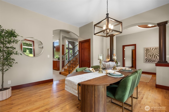 24022 SE 384th St, Enumclaw, WA 98022 - dining area featuring arched walkways, decorative columns, and baseboards
