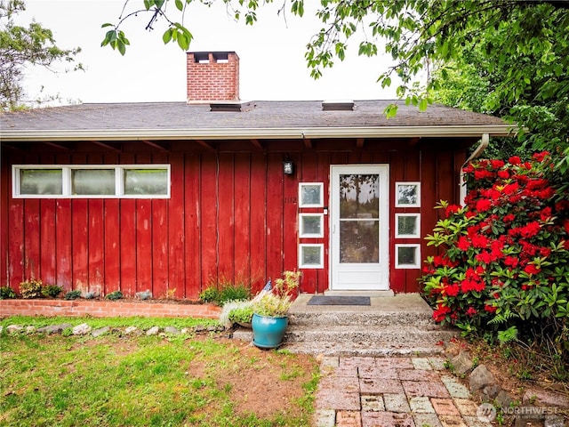 1112 Olympic Ave, Shelton, WA 98584 - property entrance featuring a chimney and board and batten siding