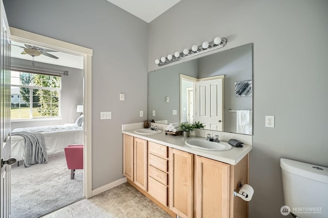 1855 Trossachs Blvd SE Unit 1404, Sammamish, WA 98075 - bathroom featuring ensuite bath, double vanity, toilet, and baseboards
