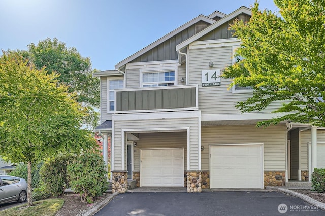1855 Trossachs Blvd SE Unit 1404, Sammamish, WA 98075 - view of front facade featuring a garage, board and batten siding, stone siding, and asphalt driveway