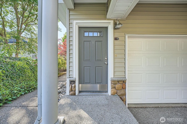 1855 Trossachs Blvd SE Unit 1404, Sammamish, WA 98075 - doorway to property featuring a garage and stone siding