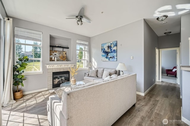 1855 Trossachs Blvd SE Unit 1404, Sammamish, WA 98075 - living area featuring a ceiling fan, a fireplace, wood finished floors, and baseboards
