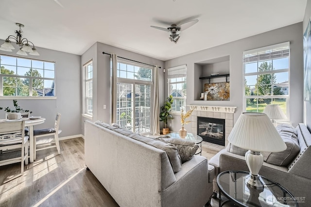 1855 Trossachs Blvd SE Unit 1404, Sammamish, WA 98075 - living room featuring plenty of natural light, wood finished floors, ceiling fan, and baseboards
