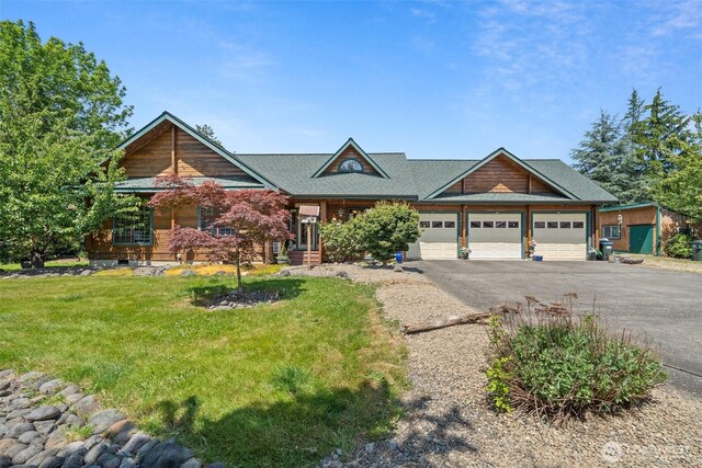 505 SW 19th St, Chehalis, WA 98532 - craftsman-style home with an attached garage, asphalt driveway, a front lawn, and a shingled roof