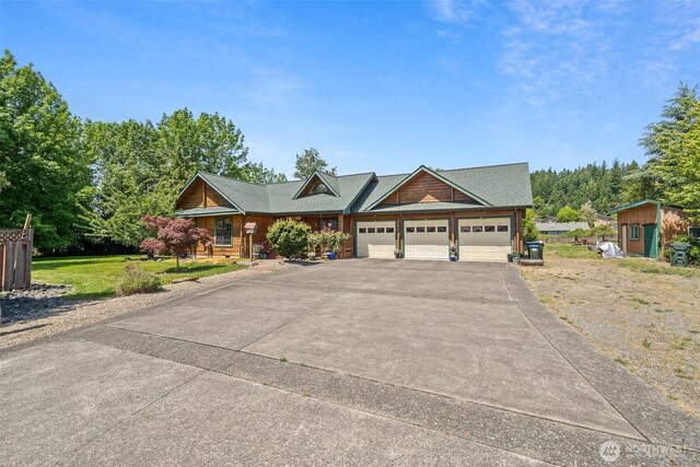 505 SW 19th St, Chehalis, WA 98532 - view of front of house with driveway, a garage, a shed, and a front yard
