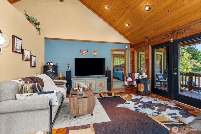 505 SW 19th St, Chehalis, WA 98532 - living area featuring french doors, plenty of natural light, a wood stove, high vaulted ceiling, and wood ceiling