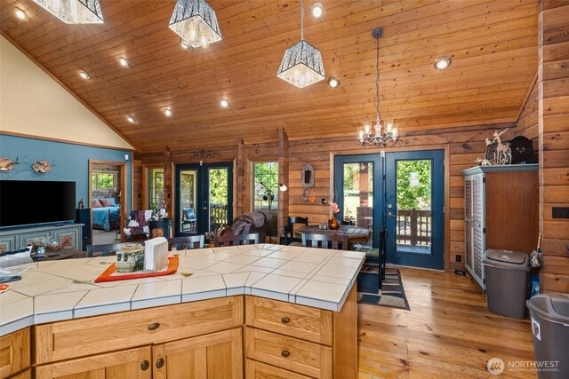 505 SW 19th St, Chehalis, WA 98532 - kitchen with open floor plan, french doors, tile countertops, a chandelier, and high vaulted ceiling