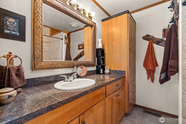 505 SW 19th St, Chehalis, WA 98532 - full bath featuring vanity, a shower with curtain, tile patterned floors, and crown molding