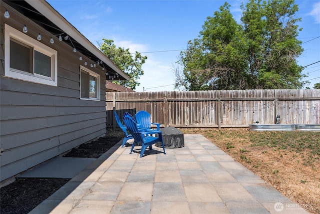 1115 S Evergreen Dr, Moses Lake, WA 98837 - fenced backyard with a patio area