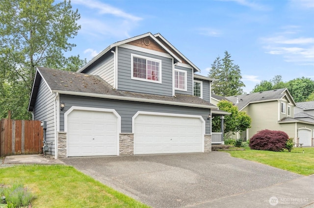 13924 Dogwood Ct, Sultan, WA 98294 - view of front of property featuring driveway, a garage, and stone siding