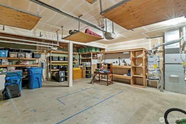 13924 Dogwood Ct, Sultan, WA 98294 - garage with water heater and a garage door opener