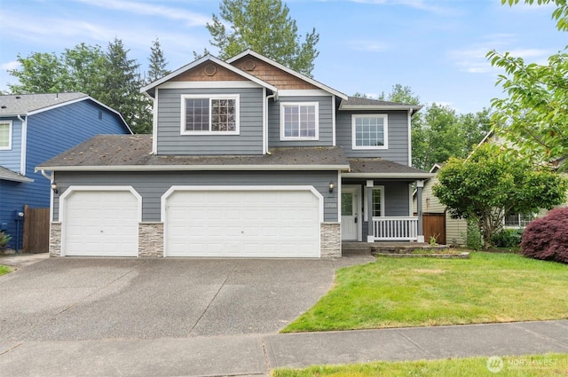 13924 Dogwood Ct, Sultan, WA 98294 - view of front of home featuring covered porch, stone siding, driveway, a front lawn, and a garage