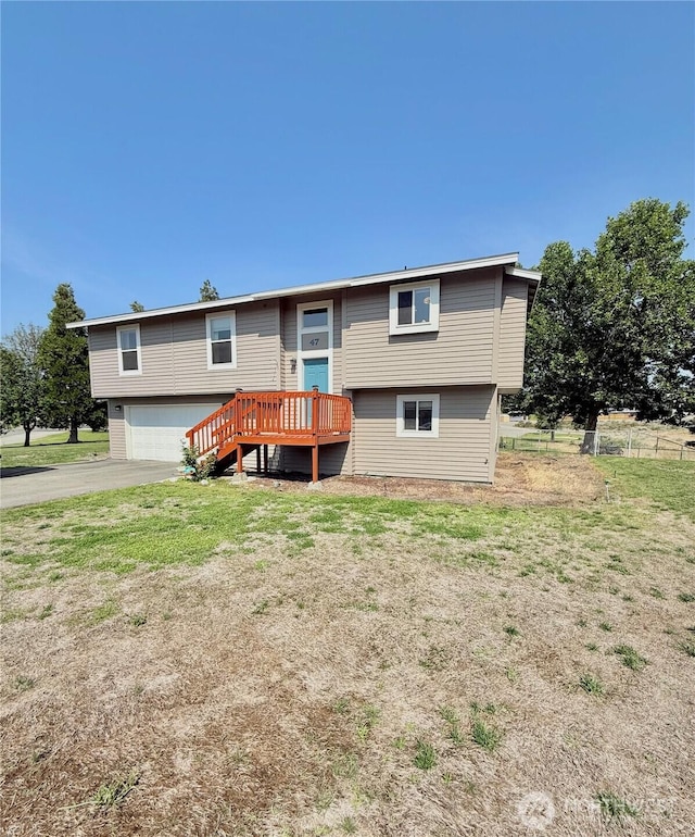 47 Kruse St, Omak, WA 98841 - rear view of property featuring an attached garage and driveway