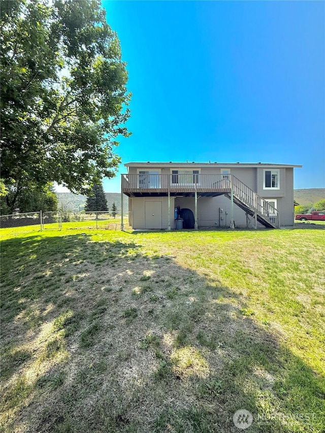 47 Kruse St, Omak, WA 98841 - rear view of house with stairway and a deck