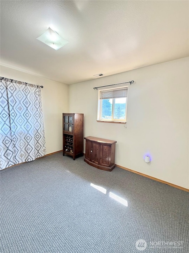 47 Kruse St, Omak, WA 98841 - carpeted spare room featuring baseboards