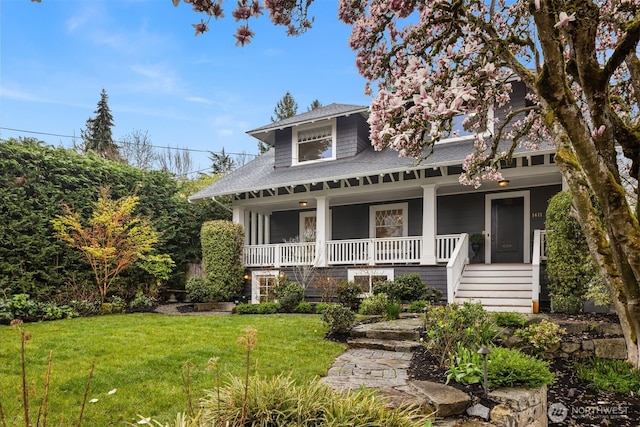 1611 Mcgilvra Blvd E, Seattle, WA 98112 - view of front of home featuring a porch, a front lawn, roof with shingles, and stairs