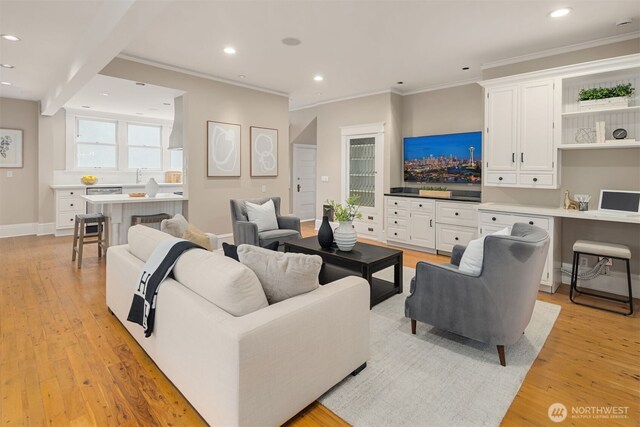 1611 Mcgilvra Blvd E, Seattle, WA 98112 - living area with crown molding, light wood finished floors, recessed lighting, and baseboards