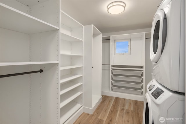 1611 Mcgilvra Blvd E, Seattle, WA 98112 - spacious closet featuring estacked washer and dryer and light wood finished floors