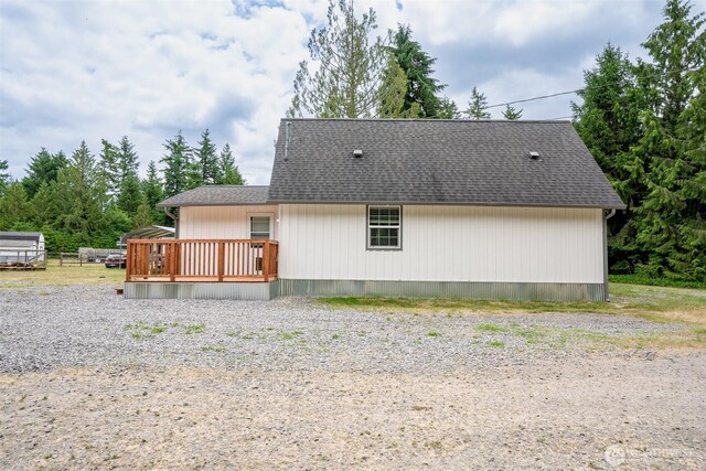 14938 Frenchie Ln SE, Yelm, WA 98597 - back of property with a deck and roof with shingles