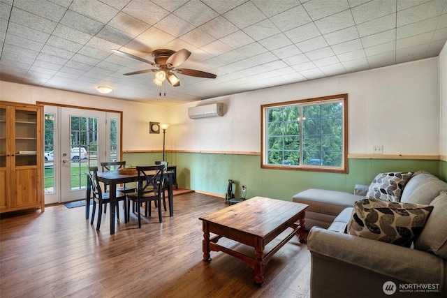 14938 Frenchie Ln SE, Yelm, WA 98597 - living room with a wall mounted AC, wood finished floors, and a ceiling fan