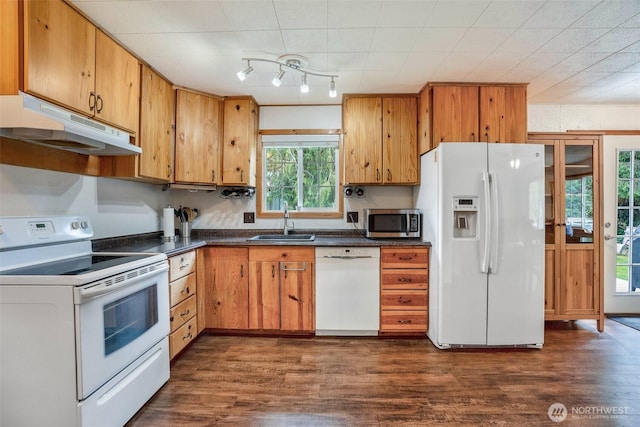 14938 Frenchie Ln SE, Yelm, WA 98597 - kitchen featuring white appliances, under cabinet range hood, dark countertops, and dark wood-style flooring