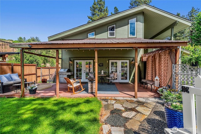 9377 Lone Pine Orchards, Leavenworth, WA 98826 - back of house with french doors, a deck, metal roof, and an outdoor hangout area