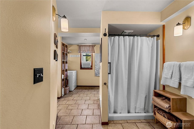 9377 Lone Pine Orchards, Leavenworth, WA 98826 - full bathroom with washing machine and clothes dryer, curtained shower, tile patterned floors, and baseboards