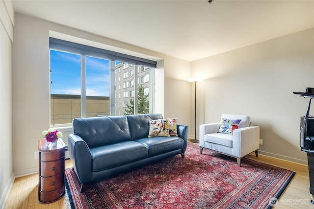 98 Union St Unit 301, Seattle, WA 98101 - living room featuring wood finished floors and baseboards