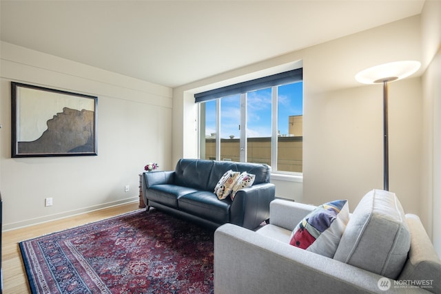 98 Union St Unit 301, Seattle, WA 98101 - living room featuring wood finished floors and baseboards
