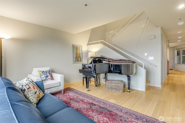 98 Union St Unit 301, Seattle, WA 98101 - living area with stairway, baseboards, light wood finished floors, and recessed lighting