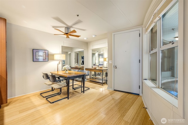 98 Union St Unit 301, Seattle, WA 98101 - dining space featuring light wood-type flooring, a ceiling fan, and baseboards