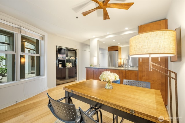 98 Union St Unit 301, Seattle, WA 98101 - dining space featuring a ceiling fan and light wood finished floors