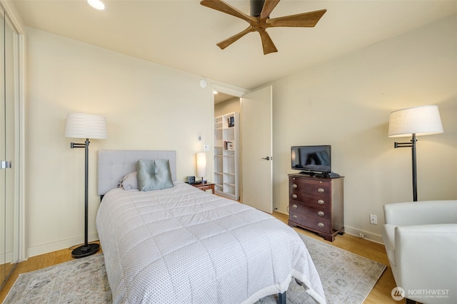 98 Union St Unit 301, Seattle, WA 98101 - bedroom featuring wood finished floors, recessed lighting, baseboards, and ceiling fan