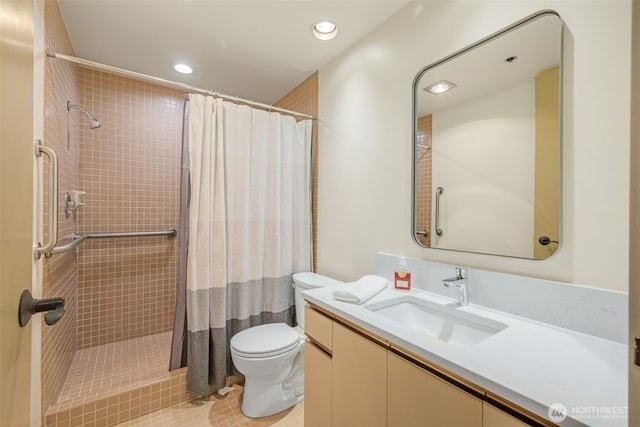 98 Union St Unit 301, Seattle, WA 98101 - bathroom featuring toilet, vanity, a tile shower, recessed lighting, and tile patterned flooring
