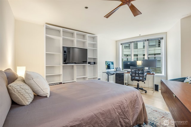 98 Union St Unit 301, Seattle, WA 98101 - bedroom with wood finished floors, a desk, and ceiling fan