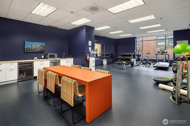 98 Union St Unit 301, Seattle, WA 98101 - office with beverage cooler, a wall of windows, a drop ceiling, and a sink
