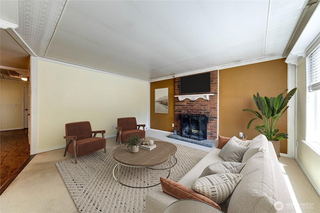 5611 128th Pl SE, Everett, WA 98208 - living room featuring carpet floors, a fireplace, baseboards, and crown molding