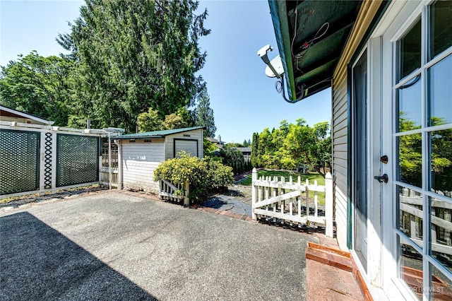 5611 128th Pl SE, Everett, WA 98208 - view of patio / terrace with an outbuilding