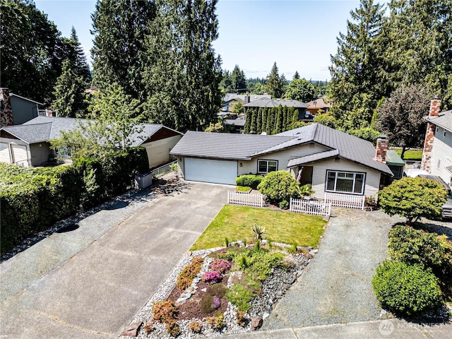 5611 128th Pl SE, Everett, WA 98208 - view of front of house with driveway, an attached garage, and a chimney