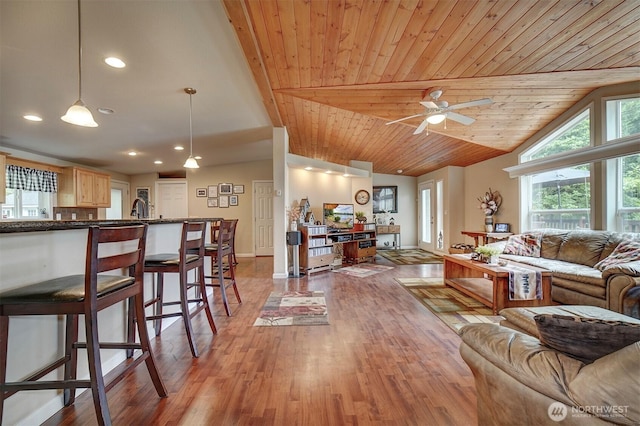 1510 E Benson Lake Dr, Grapeview, WA 98546 - living room featuring lofted ceiling, light wood-type flooring, recessed lighting, a ceiling fan, and baseboards