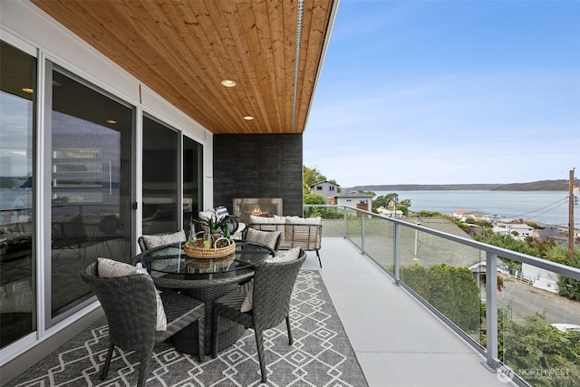 6720 Soundview Dr NE, Tacoma, WA 98422 - balcony with a water view and an outdoor living space