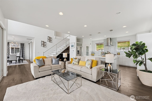 6720 Soundview Dr NE, Tacoma, WA 98422 - living room featuring stairs, wood finished floors, recessed lighting, and a chandelier