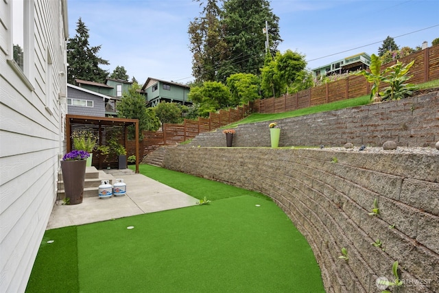6720 Soundview Dr NE, Tacoma, WA 98422 - fenced backyard with a patio area and a putting area