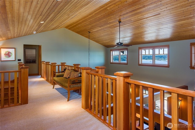 481 Grimes Riker Ln, Lopez Island, WA 98261 - hallway featuring wood ceiling, carpet flooring, an upstairs landing, and vaulted ceiling
