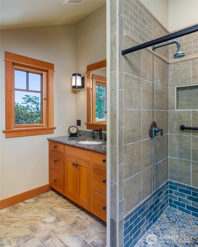 481 Grimes Riker Ln, Lopez Island, WA 98261 - full bathroom with a shower stall, vanity, lofted ceiling, and baseboards